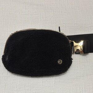 Authentic Lululemon black fleece belt bag with gold hardware